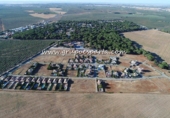 Городская земля под застройку на продажу у города Bollullos de la Mitación Фото