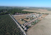 Городская земля под застройку на продажу у города Bollullos de la Mitación Фото