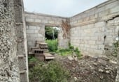 Участок с постройкой на продажу в городе La Esperanza Фото