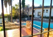 Отдельно стоящий дом с участком на продажу в городе Campo-Mijas Фото