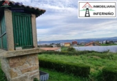 Отдельно стоящий дом с участком на продажу в городе Ferrol. Фото