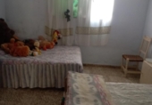 Загородный дом с участком на продажу в городе Huelma Фото