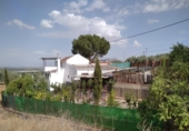 Загородный дом с участком на продажу в городе Loja Фото