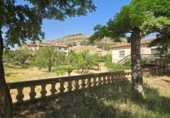 Участок с постройкой на продажу в городе Alhama de Aragón Фото