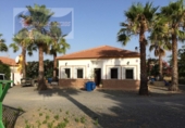 Отдельно стоящий дом с участком на продажу в городе Cartaya Фото