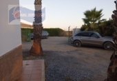 Отдельно стоящий дом с участком на продажу в городе Cartaya Фото
