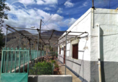Отдельно стоящий дом с участком на продажу в городе San Bartolomé de Tirajana Фото