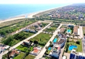 Отдельно стоящий дом с участком на продажу в городе Oliva Фото