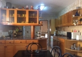 Отдельно стоящий дом с участком на продажу в городе Бенидорм Фото