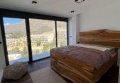 Отдельно стоящий дом с участком на продажу в городе Altea Фото