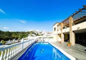 Отдельно стоящий дом с участком на продажу в городе Campo-Mijas Фото