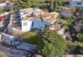 Отдельно стоящий дом с участком на продажу в городе Jávea Фото