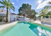 Отдельно стоящий дом с участком на продажу в городе Altea Фото
