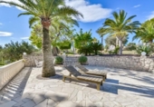 Отдельно стоящий дом с участком на продажу в городе Altea Фото