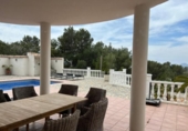 Отдельно стоящий дом с участком на продажу в городе Altea Фото