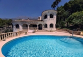 Отдельно стоящий дом с участком на продажу в городе Altea Фото