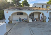Отдельно стоящий дом с участком на продажу в городе Jávea Фото