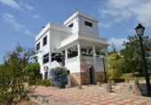 Отдельно стоящий дом с участком на продажу в городе Altea Фото
