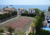 Отдельно стоящий дом с участком на продажу в городе Altea Фото