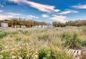 Городская земля под застройку на продажу у города Уэльва Фото