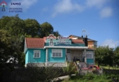 Отдельно стоящий дом с участком на продажу в городе Ferrol. Фото