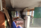 Участок с постройкой на продажу в городе Куэнка. Фото