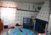 Дом с участком на продажу в городе Трухильо. Фото