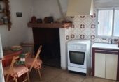 Отдельно стоящий дом с участком на продажу в городе Caudiel. Фото