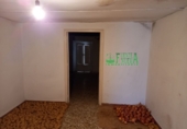 Дом с участком на продажу в городе Fuentes de León. Фото
