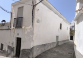 Дом с участком на продажу в городе Castell de Ferro. Фото