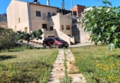 Отдельно стоящий дом с участком на продажу в городе Castelló de Rugat Фото