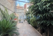 Отдельно стоящий дом с участком на продажу в городе Sant Feliu de Llobregat Фото
