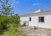 Отдельно стоящий дом с участком на продажу в городе Jávea Фото
