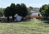 Участок с постройкой на продажу в городе Уэльва Фото