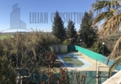 Отдельно стоящий дом с участком на продажу в городе Уэльва Фото
