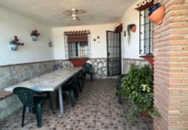 Отдельно стоящий дом с участком на продажу в городе Torrox Фото