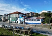 Дом с участком на продажу в городе Comillas Фото