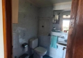 Дом с участком на продажу в городе O Irixo. Фото