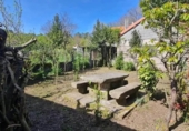 Дом с участком на продажу в городе O Irixo. Фото
